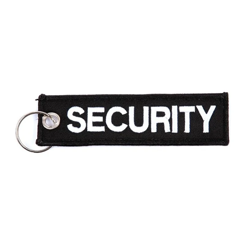 PORTE-CLÉ FOSTEX SECURITY EN TISSU BRODÉ NOIR/BLANC